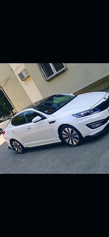 kia carnival: Kia Optima – ağ rəng, sedan, idman üslublu eksteryer paketli. Əsas — 2