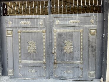 Bunker qapıları: Dekorativ elementlərlə bəzədilmiş bu dəmir darvaza möhkəm və