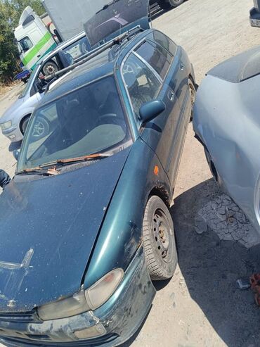 Другие детали кузова: Универсал Mitsubishi Lancer, модель пятого поколения, в темно-зеленом — 2