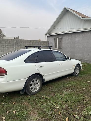 пинин ио: Mazda Cronos: 1994 г., Механика, Бензин, Седан — 4