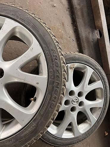 lancer 9: Комплект зимних колес на литых дисках Mazda. Характеристики: - Диски — 1