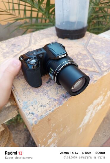 iwlenniw notbuklar: Nikon markalı qara rəngli rəqəmsal fotoaparat təklif olunur. Bu model