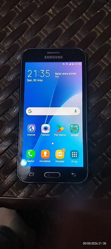 deri çanta: Samsung Galaxy J1 2016, 2 GB, rəng - Qara, İki sim kartlı — 4