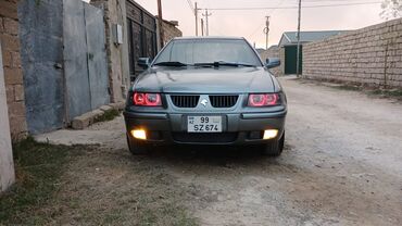 Iran Khodro: Samand sedan – benzinli, ön ötürücülü. Gümüşü rəng.nömrə nişanı — 7