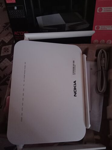 Nokia G-140W-C model nömrəli Wi-Fi router. Bu cihaz evdə və ya ofisdə