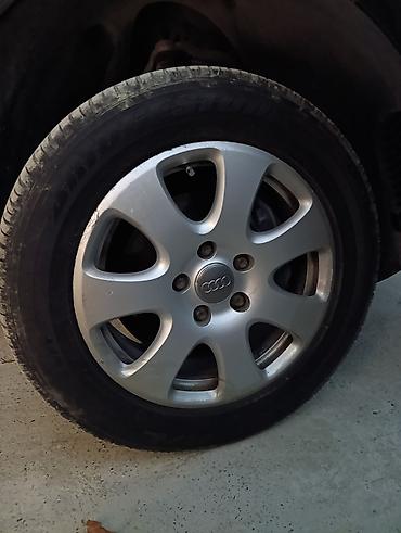 maşin tekerleri: Audi orijinal yüngül lehimli disklər və Bridgestone Dueler H/L — 2