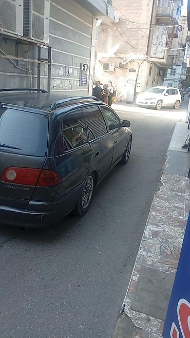 cesqa masin: Toyota Carina E Universal (station wagon) - Kuzov: universal, qara — 3