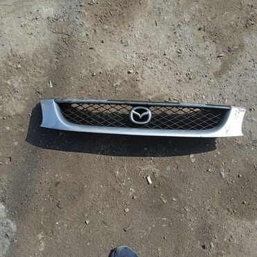 Решетки радиатора: Решетка радиатора Mazda Б/у — 21