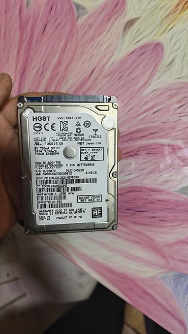 ps1 disk: HGST və Toshiba 2.5" noutbuk HDD-ləri - HGST 750 GB, model — 1