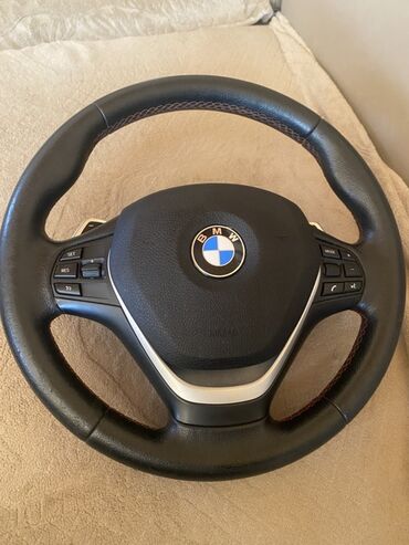 фольксваген новый кузов: BMW modelləri üçün nəzərdə tutulmuş qara rəngli sükan. Sükanın