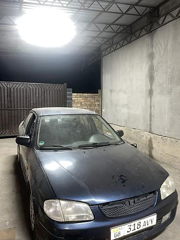 червяк 124: Mazda 323: 1999 г., 1.5 л, Механика, Седан — 1