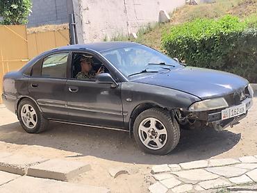 авто толщиномер: Mitsubishi Carisma: 2001 г., Механика, Бензин, Седан — 1