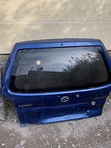 с 500: Крышка багажника Mazda Demio (DW, 1998–2002), синяя. - Оригинальная — 2