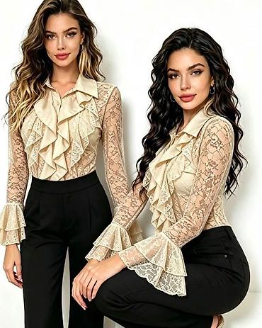 elastin poliamid: Ženska elegantna čipkana bluza sa volanima

Kosulja: 2.700 dinara — 5