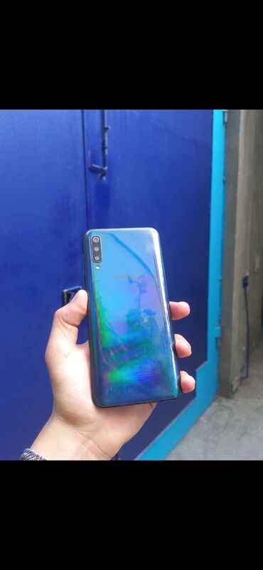 telefon banan: Samsung Galaxy A50, 64 ГБ, цвет - Черный, Отпечаток пальца, Face ID