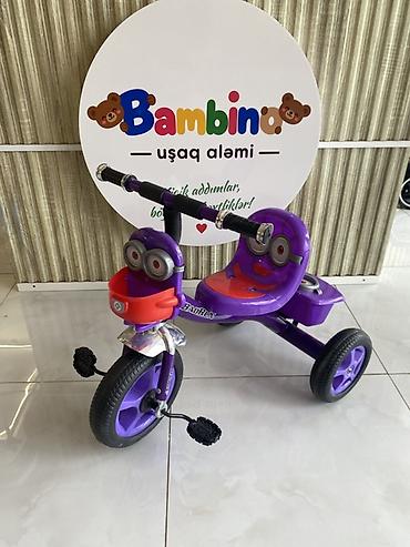 Uşaqlar üçün 3 təkərli velosiped. Parlaq bənövşəyi rəngdə, sevimli