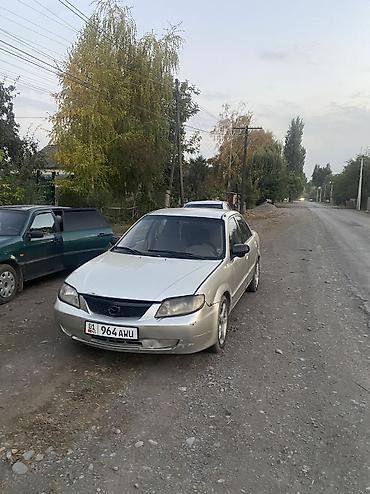 машина daihatsu: Mazda 323: 2001 г., 1.5 л, Автомат, Газ, Седан — 2