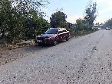 demio sport: Mazda 323: 2001 г., 1.8 л, Автомат, Бензин, Седан — 9