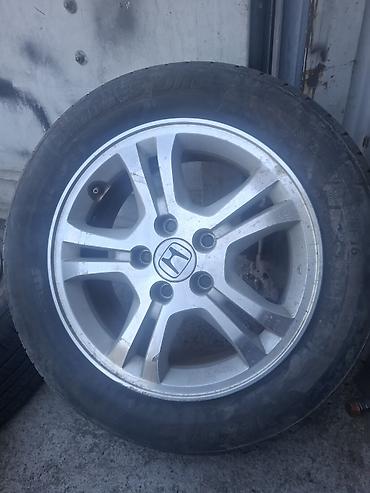 aeolus e70: Литой диск Honda с шиной 205/60 R16 - Оригинальный литой диск Honda — 1