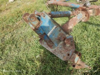 yarım qosqular: Çarxlı ot yığan (barmaqlı tırmıq) – traktor asqısına qoşulan mexanizm