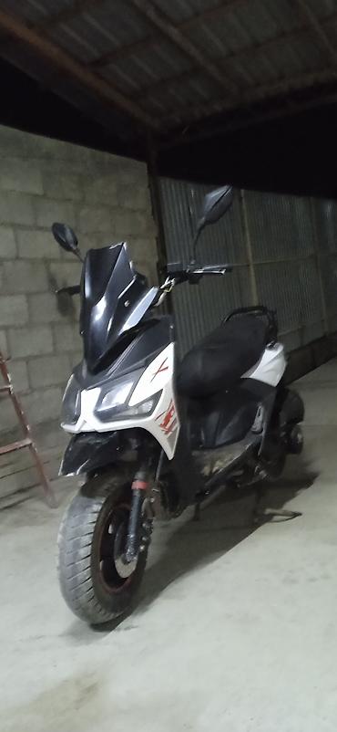 t max: Скутер городского типа, ориентировочно 50–150 см³. Агрессивный дизайн — 1