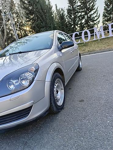Opel: Opel Astra H – gümüşü rəng, 5 qapılı hetçbek.Hazır maşındı.ikinci — 7