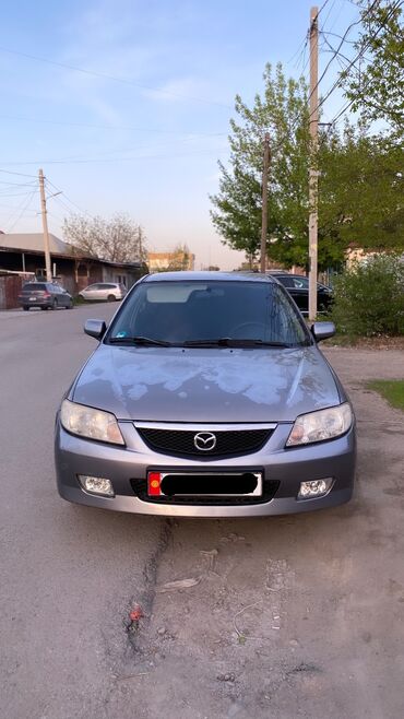 Mazda 323: 2003 г., 1.6 л, Механика, Бензин, Седан