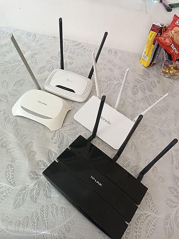 ucuz wifi modem: Wi‑Fi routerlər toplusu Brendlər: TP‑Link və Tenda. Korpusda müxtəlif — 5
