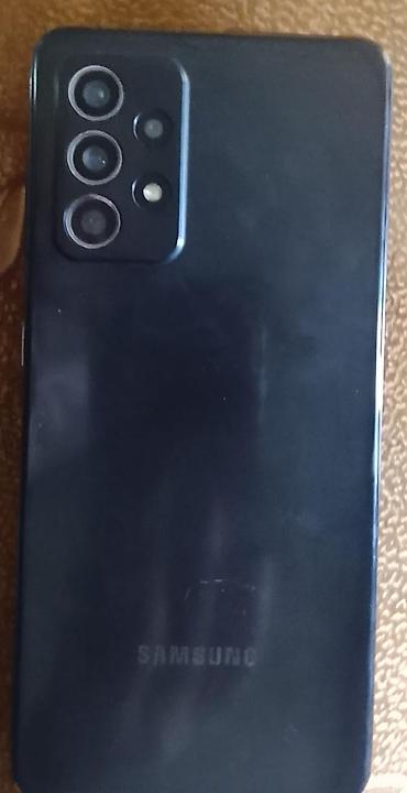 note 2: Смартфон Samsung (серия Galaxy A, темный цвет корпуса). - Тыловой — 1