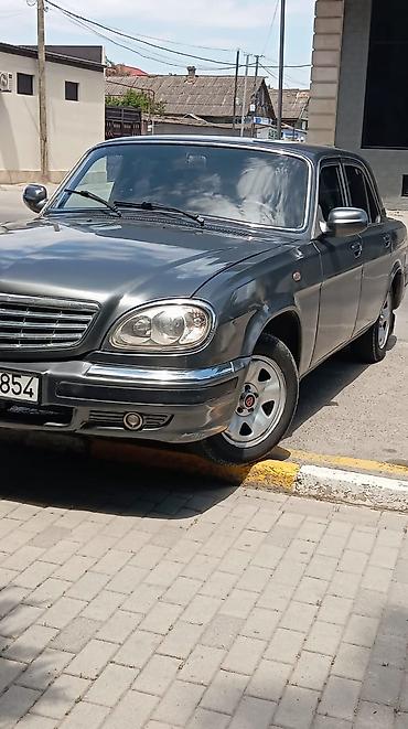 volga 2110: GAZ Volga 31105 sedan - Kuzov: 4 qapılı sedan, tünd boz rəng, xrom ön — 1
