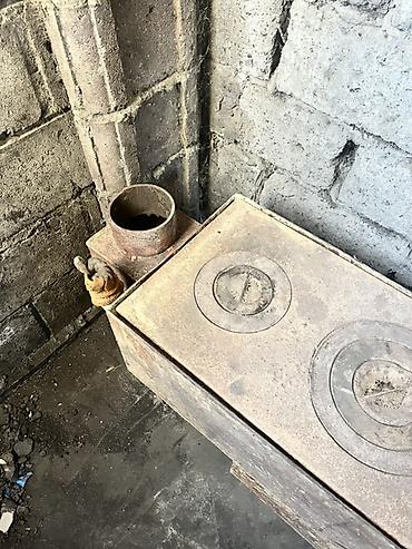 Дровяные печи: Металлическая дровяная печь-плита с варочной поверхностью на 2 — 3
