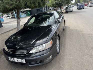 меняю на недвижимость: Черный седан Lexus ES 300 — это элегантный автомобиль с классическим