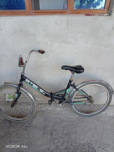 velosipedlər isma: STELS Pilot 24 şəhər/komfort tipli velosiped.Nasosda üstündə verilir — 2
