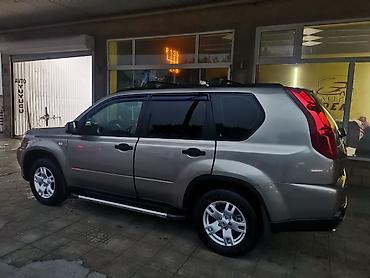 jetta 2008: Nissan X-Trail model avtomobili. Açıq qəhvəyi rəngdə, dam relsləri ilə — 7