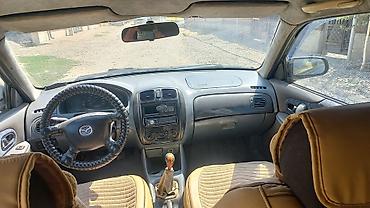 mazda d: Mazda Familia: 2002 г., 1.5 л, Механика, Бензин, Универсал — 7