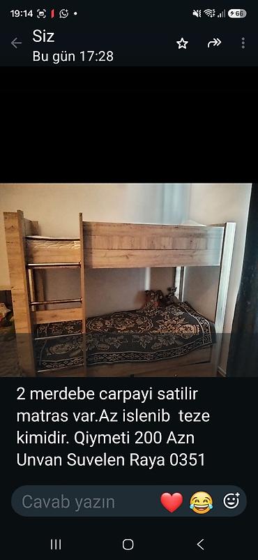 İki mərtəbəli çarpayı satılır. Taxta konstruksiya, üst mərtəbəyə