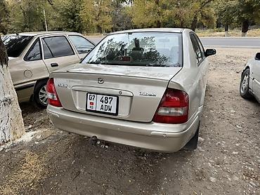 пленка авто: Mazda 323: 1998 г., Механика, Бензин, Седан — 3