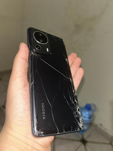 Мобильные телефоны: Xiaomi 12 Lite, 128 ГБ, цвет - Черный, 
 Битый — 8