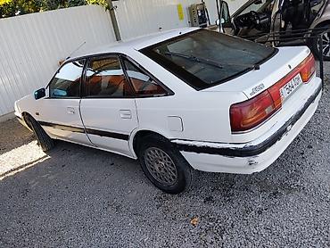 рессор мазовский: Mazda 626: 1990 г., 2 л, Механика, Бензин, Седан — 4