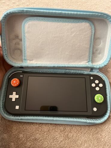 çant: Nintendo Switch Lite. Ela veziyyetdedir ve hec bir problemi yoxdur
