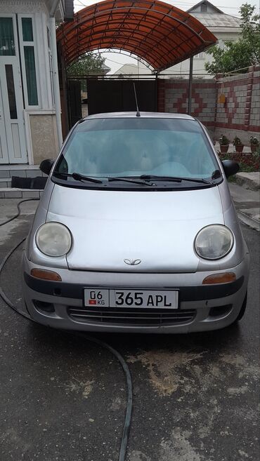 шины на матиз цена: Серебристый городской автомобиль Daewoo Matiz, идеально подходящий для