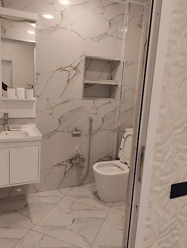 Tavan işləri: Təsvir: - Zövqlə təmir edilmiş, işıqlı mənzil interyeri. Geniş dəhliz — 13