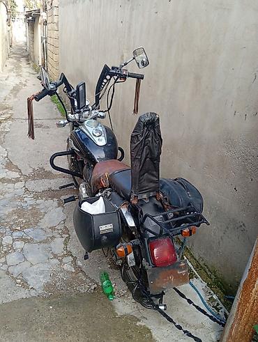 zarya: Kruizer tipli motosiklet Xüsusiyyətlər: - Tək silindrli benzin — 3