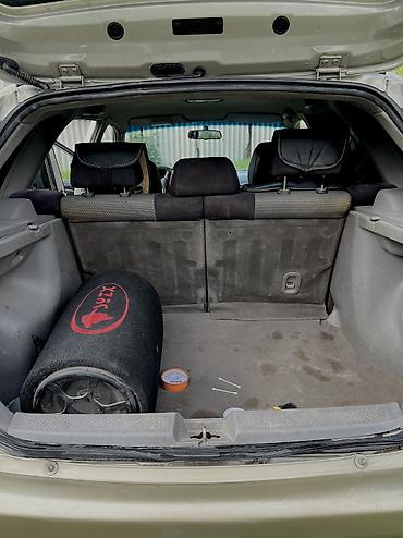 Mazda: Mazda 323: 2003 г., Бензин — 8