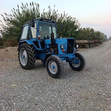 vaz 2106 qapilari: Mavi rəngli kabinəli təkərli traktor - Güclü dizel mühərrik, mexaniki — 2