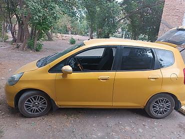 прикурит машина: Honda Fit: 2006 г., 1.3 л, Автомат, Бензин, Хэтчбэк — 2