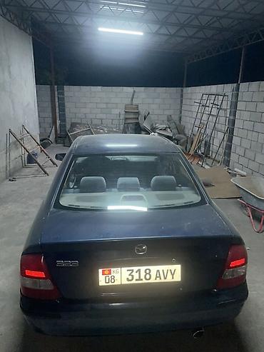 червяк 124: Mazda 323: 1999 г., 1.5 л, Механика, Седан — 2