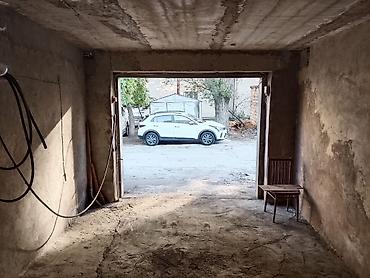 Аренда гаража: 9-cu Mikrorayonda, yol kənarında yerləşən daş qaraj icarəyə verilir — 2