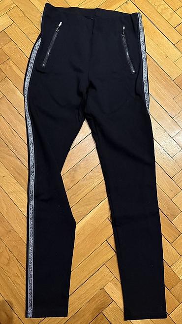 Pantalone, Farmerke, Šortsevi: Crne ženske helanke/pantalone uskog kroja sa dekorativnim srebrnim — 4