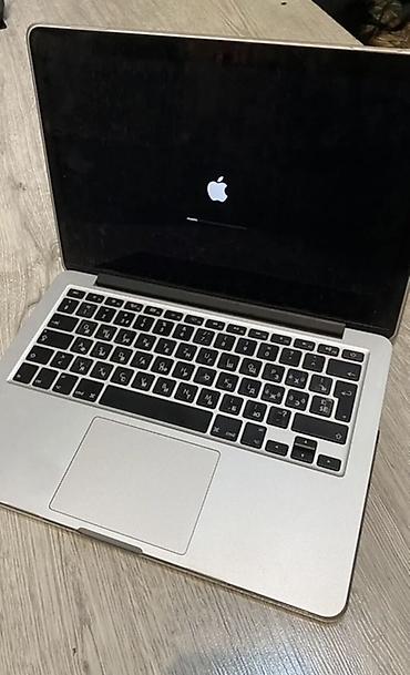 кронштейн для проектора на потолок: Ноутбук Apple MacBook в серебристом корпусе. На фото видно — 1